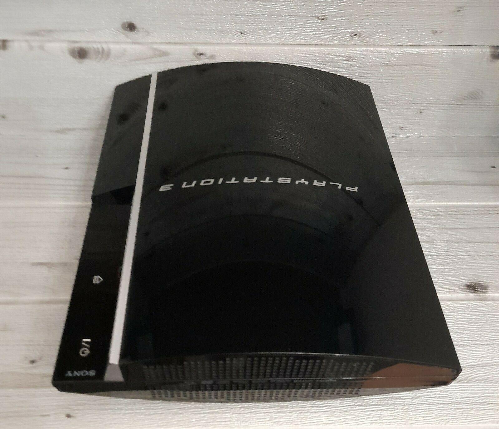 PS3 Gaming Console + 2 Pads + 5 Games